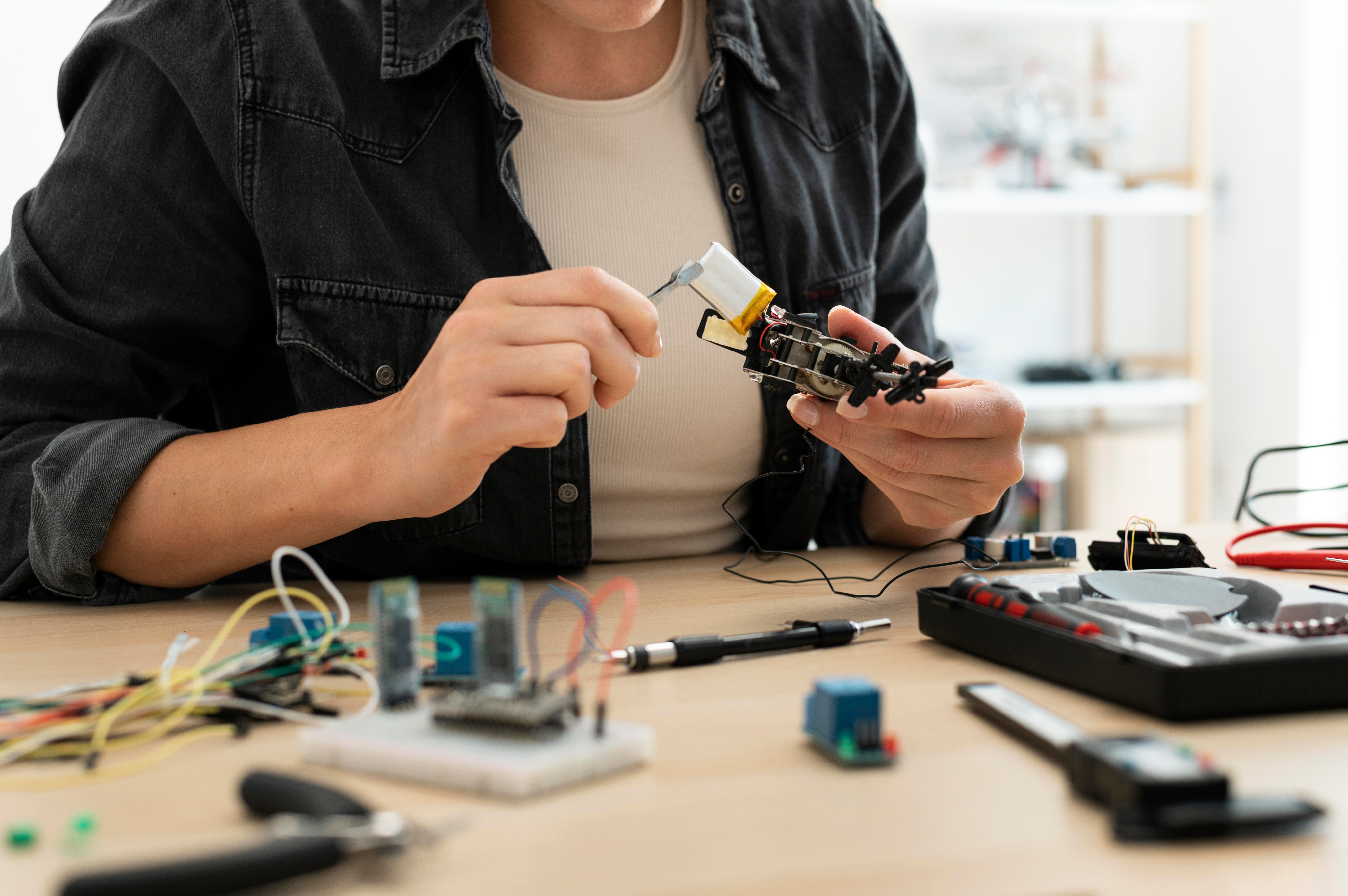 A lab visitor working with an autonomous mobile robot